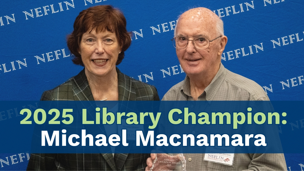 Two people smiling in a photo, pictured left to right: Debra Rhodes Gibson and Michael Macnamara. The text reads 2025 Library Champion: Michael Macnamara
