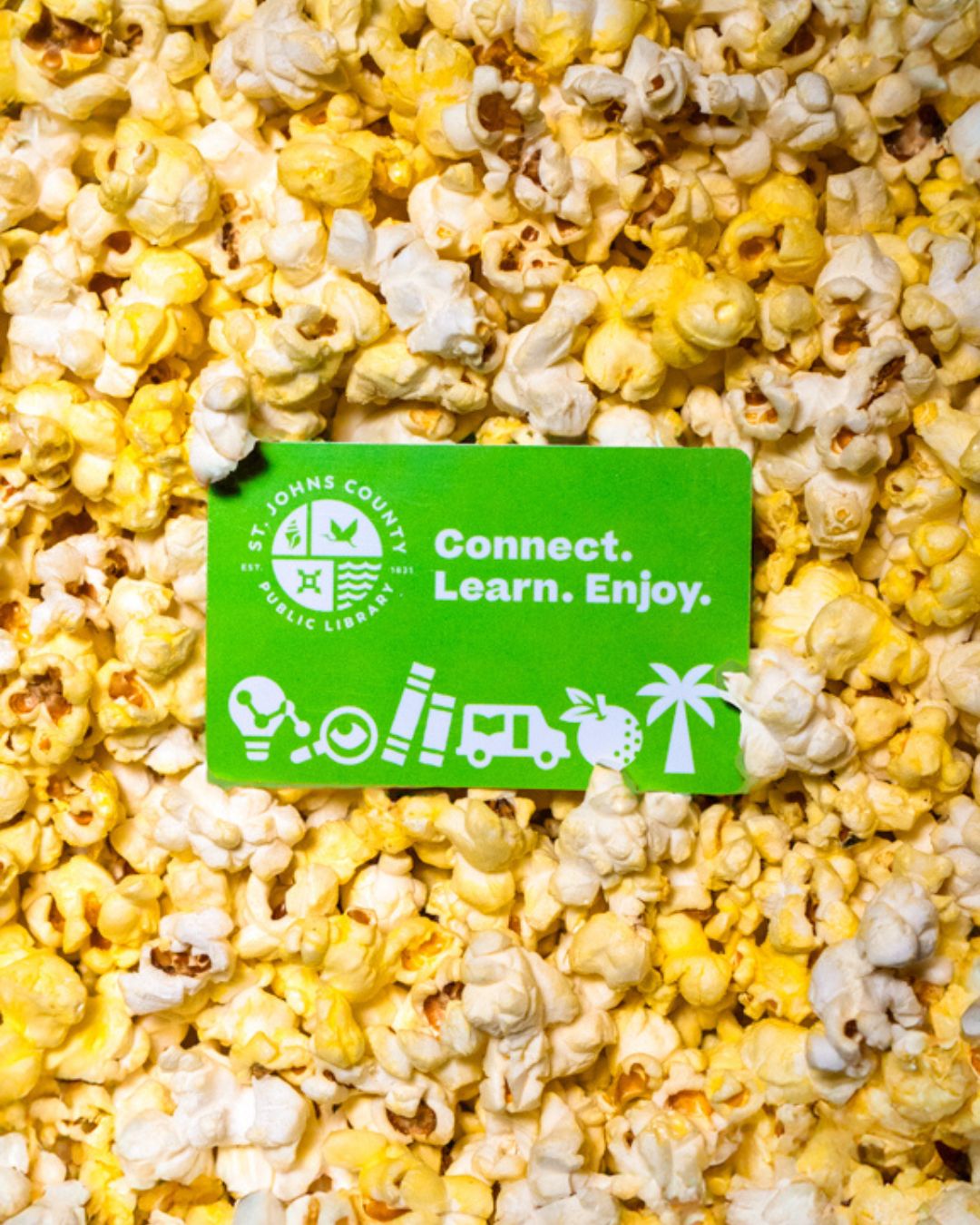 A vibrant green library card with 